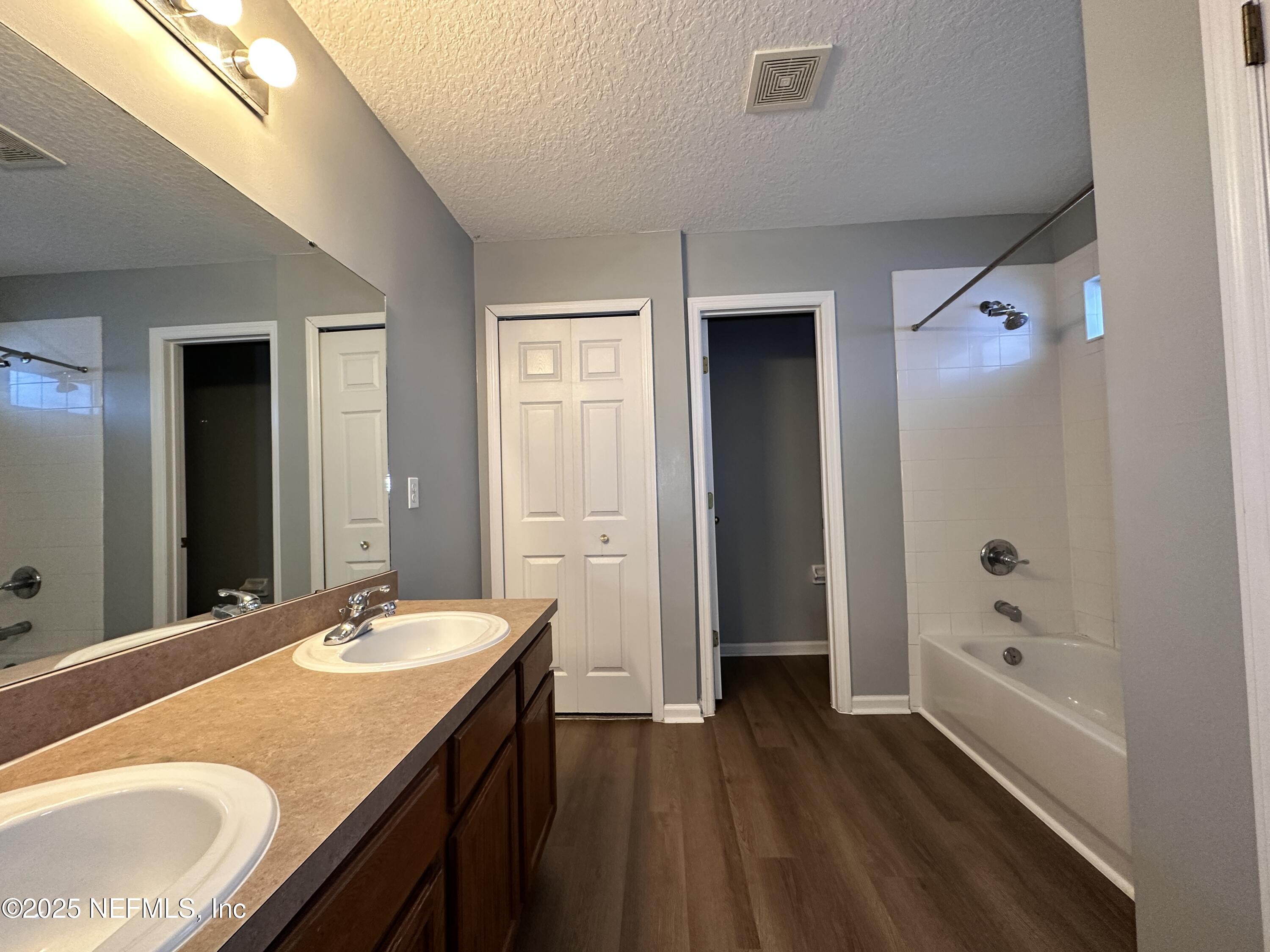 2786 Cross Creek Drive Green Cove Springs, FL 32043 - Photo 8 of 16 a bathroom with a sink and a mirror