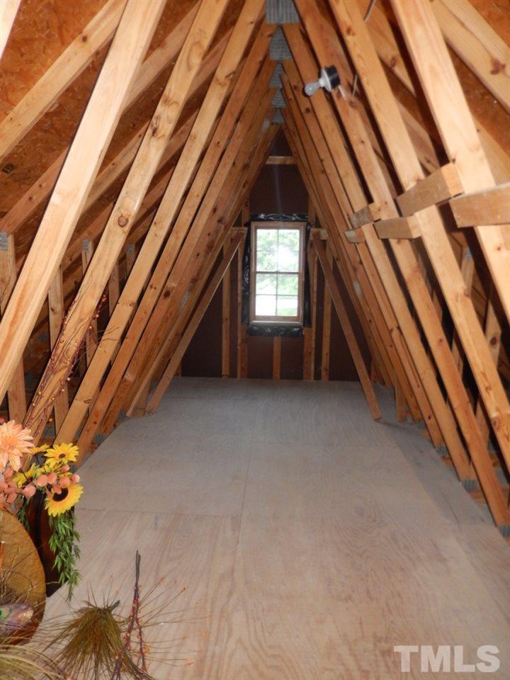 8837 Braceridge Road Raleigh, NC 27613 - Photo 22 of 25 a view of an empty room with a window