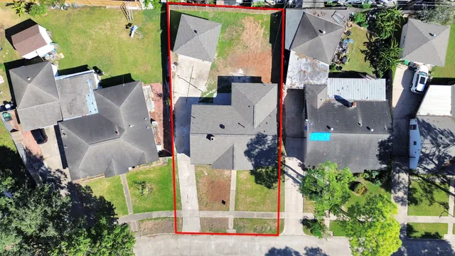 an aerial view of a house with outdoor space