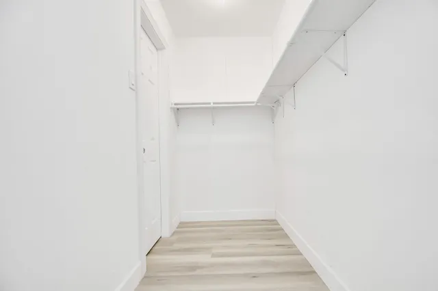 a view of an empty walk in closet