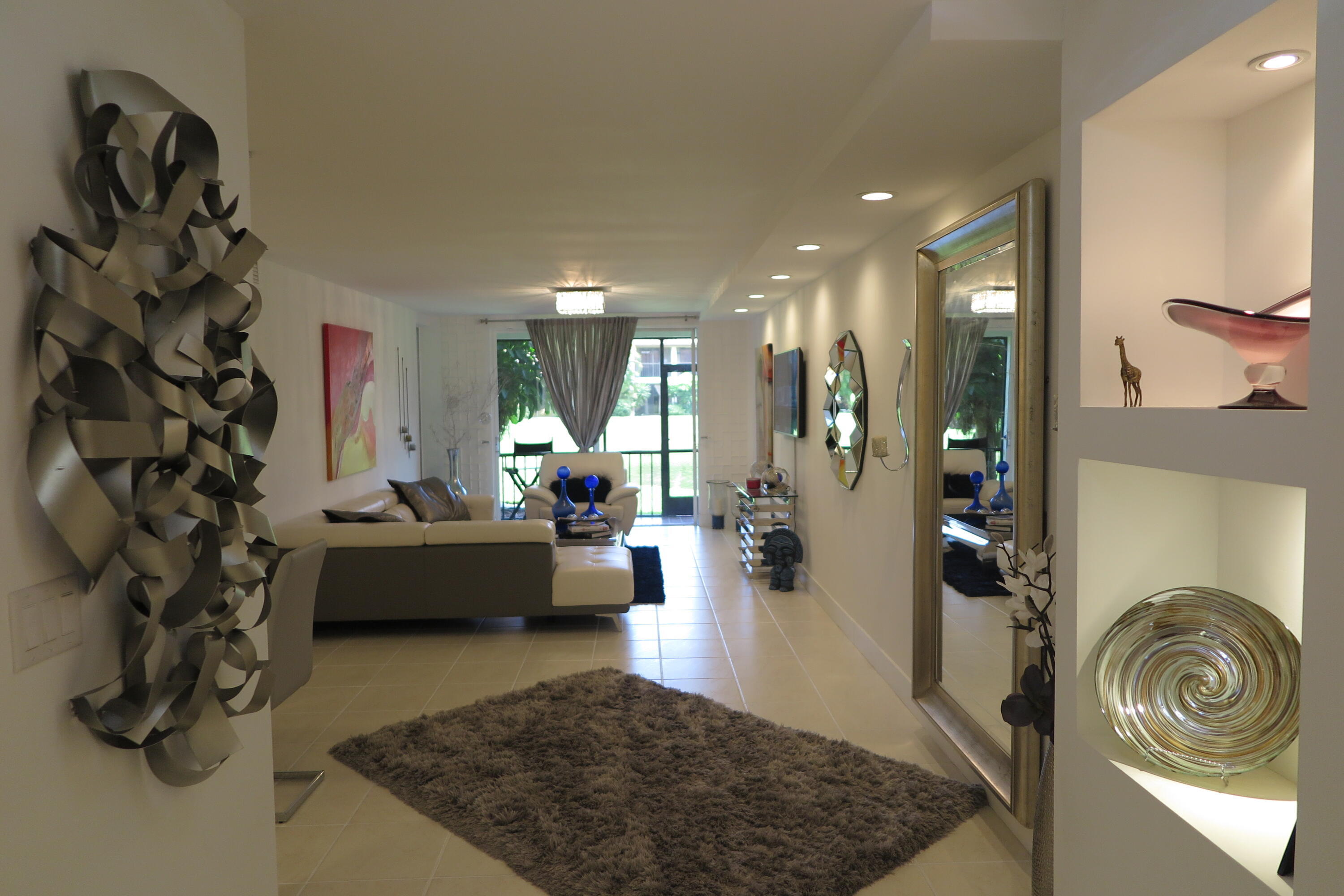 7875 La Mirada Drive Boca Raton, FL 33433 - Photo 4 of 31 a living room with furniture and a rug