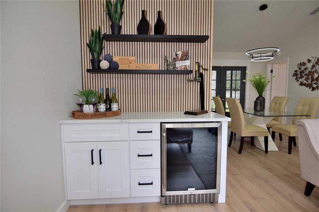 4014 Treetop Circle Spring Hill, FL 34606 - Photo 12 of 31 a living room with furniture and a wooden floor