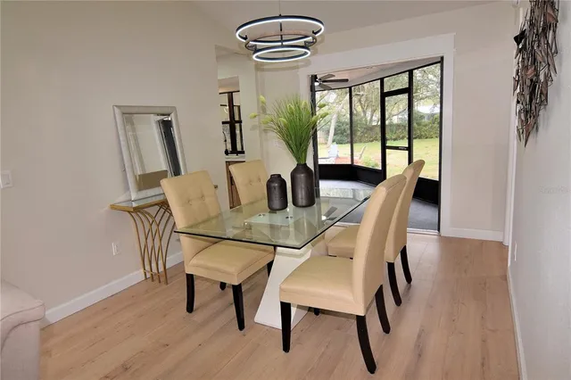 a dining room with furniture and window