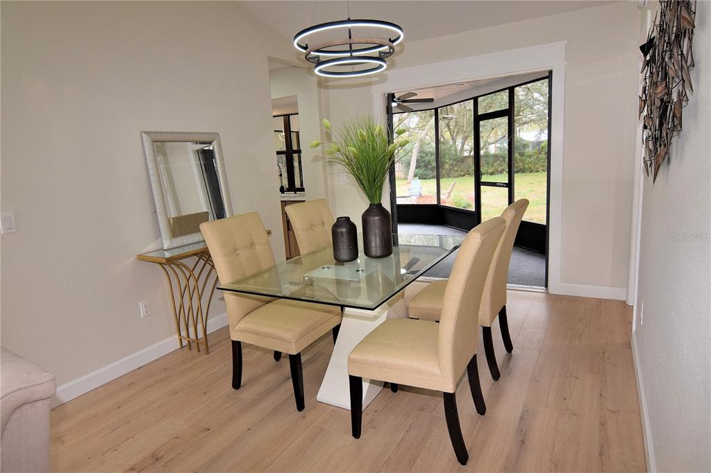 4014 Treetop Circle Spring Hill, FL 34606 - Photo 16 of 31 a dining room with furniture and window