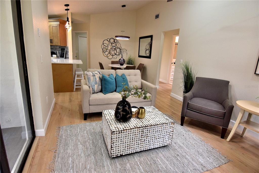 4014 Treetop Circle Spring Hill, FL 34606 - Photo 18 of 31 a living room with furniture and a rug