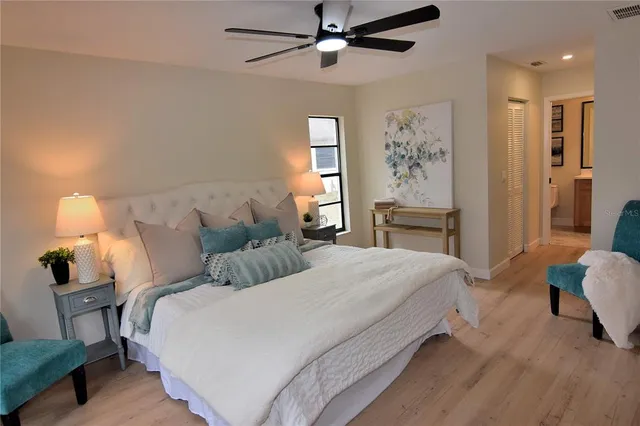 a bedroom with bed and window