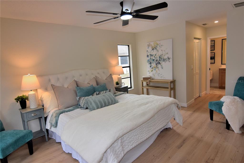 4014 Treetop Circle Spring Hill, FL 34606 - Photo 20 of 31 a bedroom with bed and window