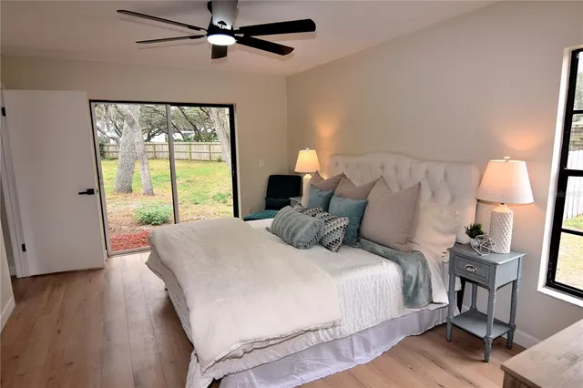 a bedroom with a large bed and a window