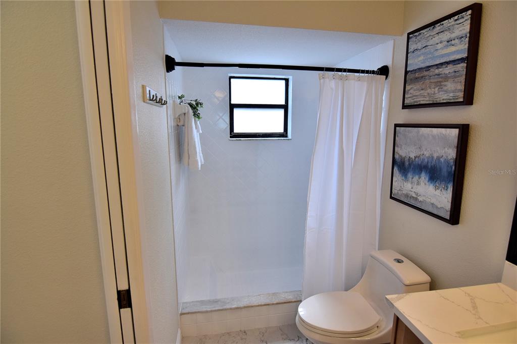 4014 Treetop Circle Spring Hill, FL 34606 - Photo 23 of 31 a bathroom with a toilet sink and tub