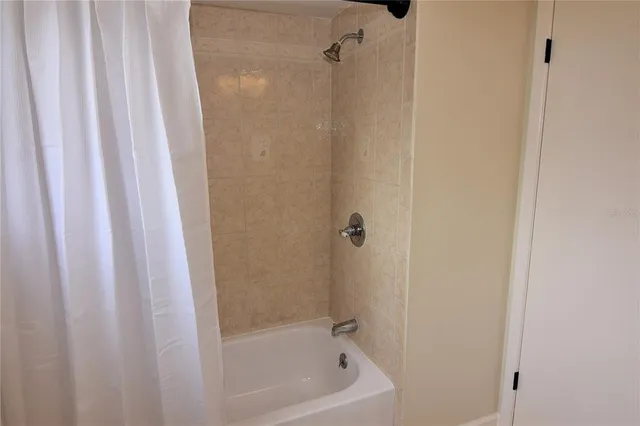 a close up of a bathtub curtain