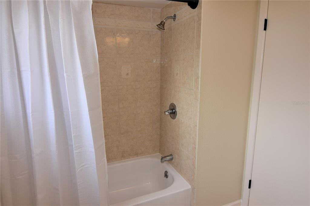 4014 Treetop Circle Spring Hill, FL 34606 - Photo 26 of 31 a close up of a bathtub curtain