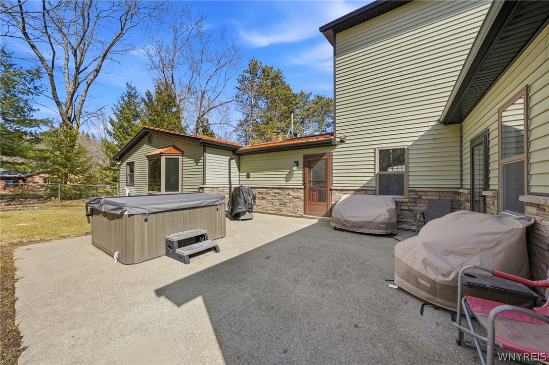7228 Lower East Hill Road Boston, NY 14033 - Photo 34 of 46 Back of house. Hot tub stays. Aggregate concrete p