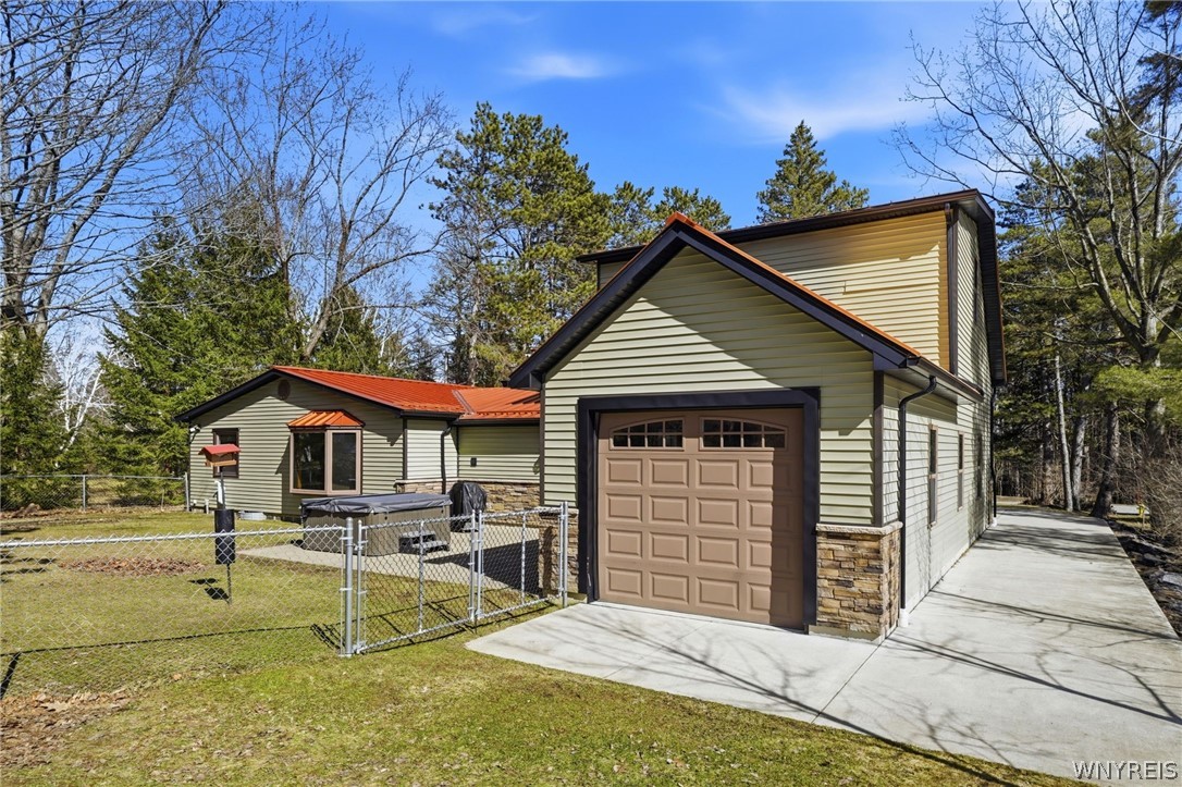 7228 Lower East Hill Road Boston, NY 14033 - Photo 4 of 46 Garage doors on front and back of garage.