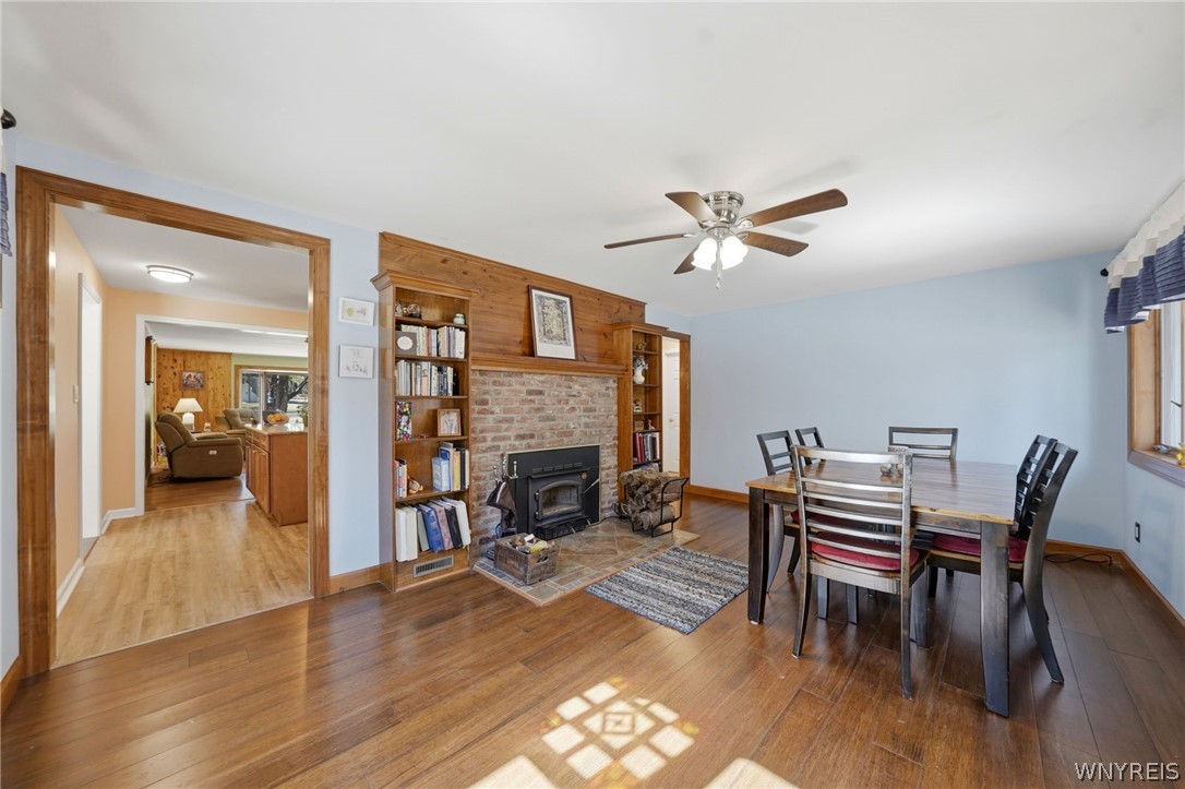 7228 Lower East Hill Road Boston, NY 14033 - Photo 6 of 46 Dining room with wood burning fireplace.