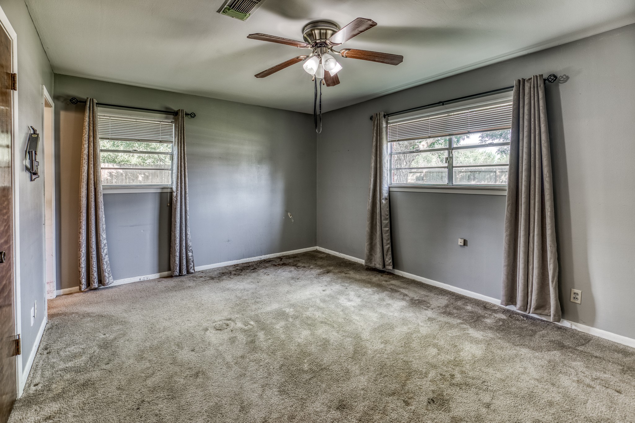1687 Eagle Lake Road Sealy, TX 77474 - Photo 21 of 27 a view of a livingroom with a chandelier fan and windows