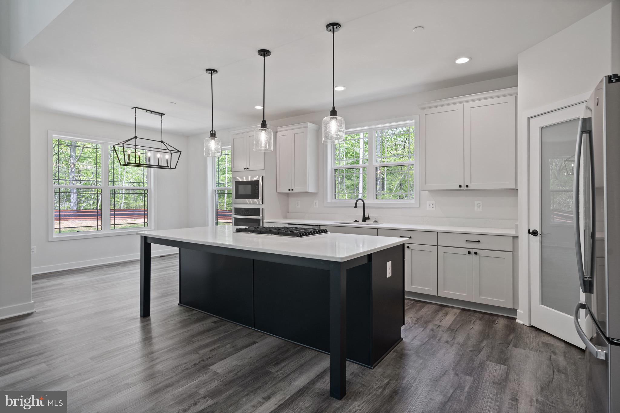 18688 Hebb Rd Valley Valley Lee, MD 20692 - Photo 17 of 57 Modern kitchen with sleek design and light.