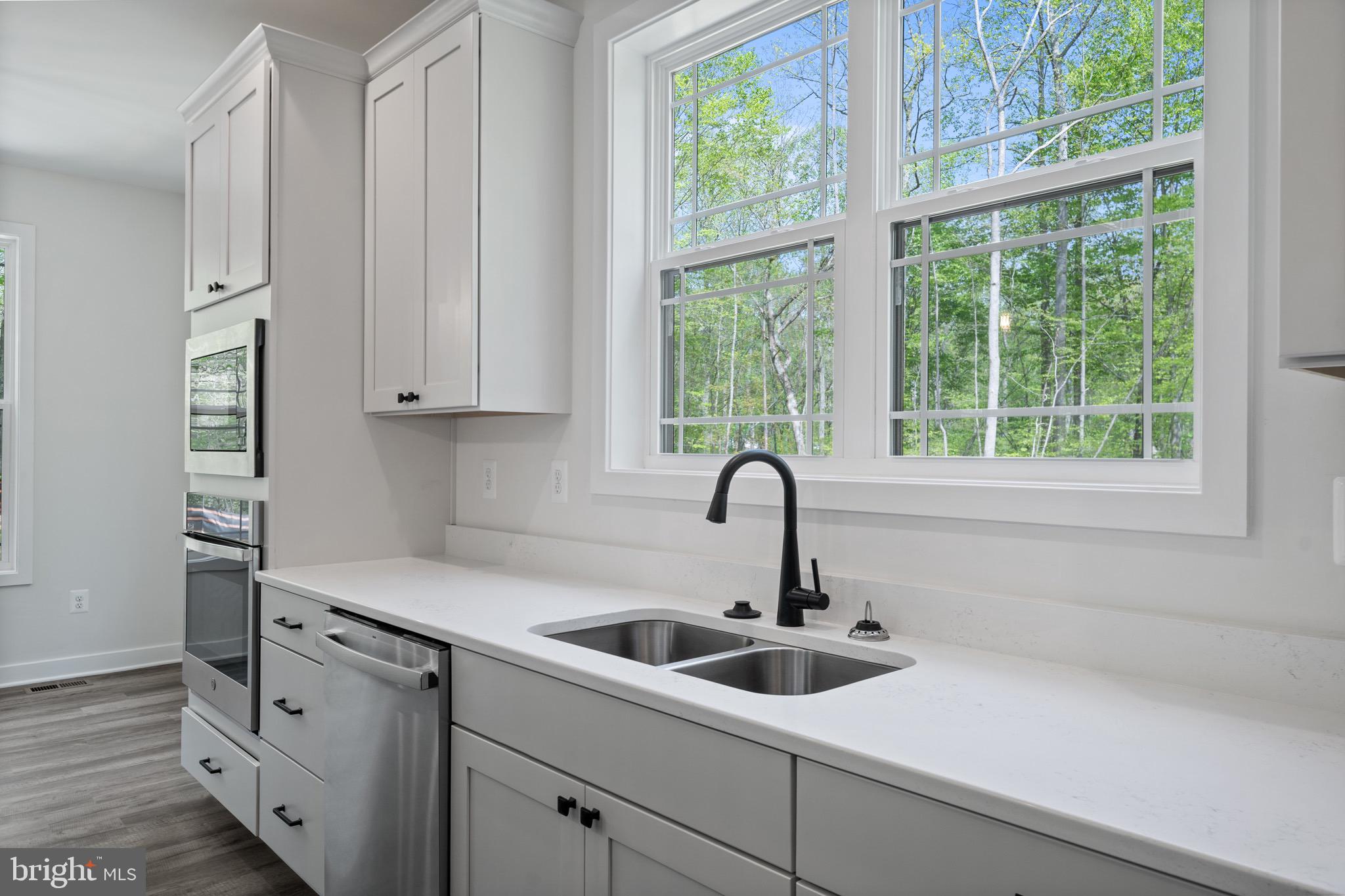 18688 Hebb Rd Valley Valley Lee, MD 20692 - Photo 20 of 57 Bright and airy kitchen with nature views.