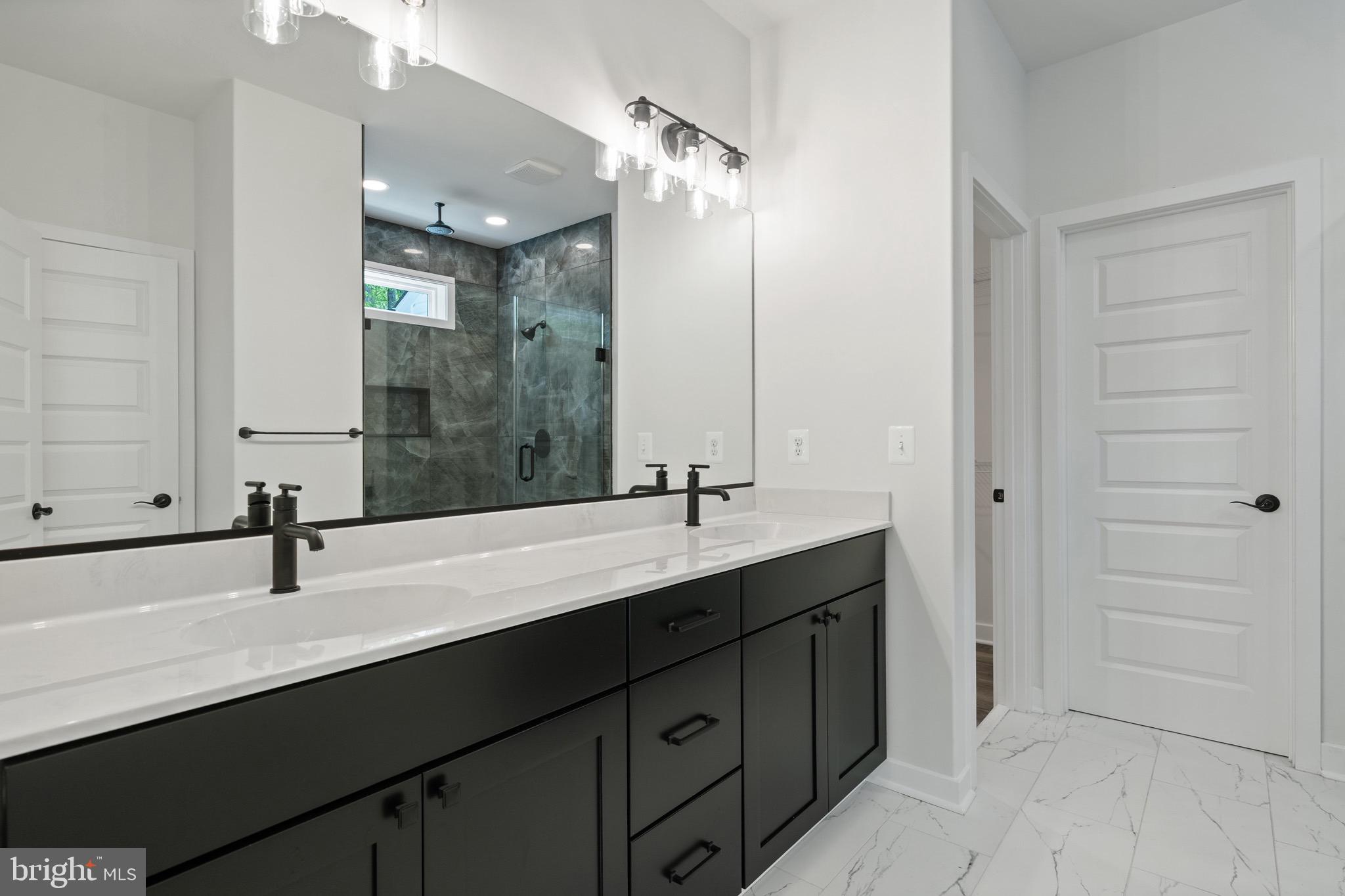 18688 Hebb Rd Valley Valley Lee, MD 20692 - Photo 26 of 57 Sleek modern bathroom with elegant finishes.