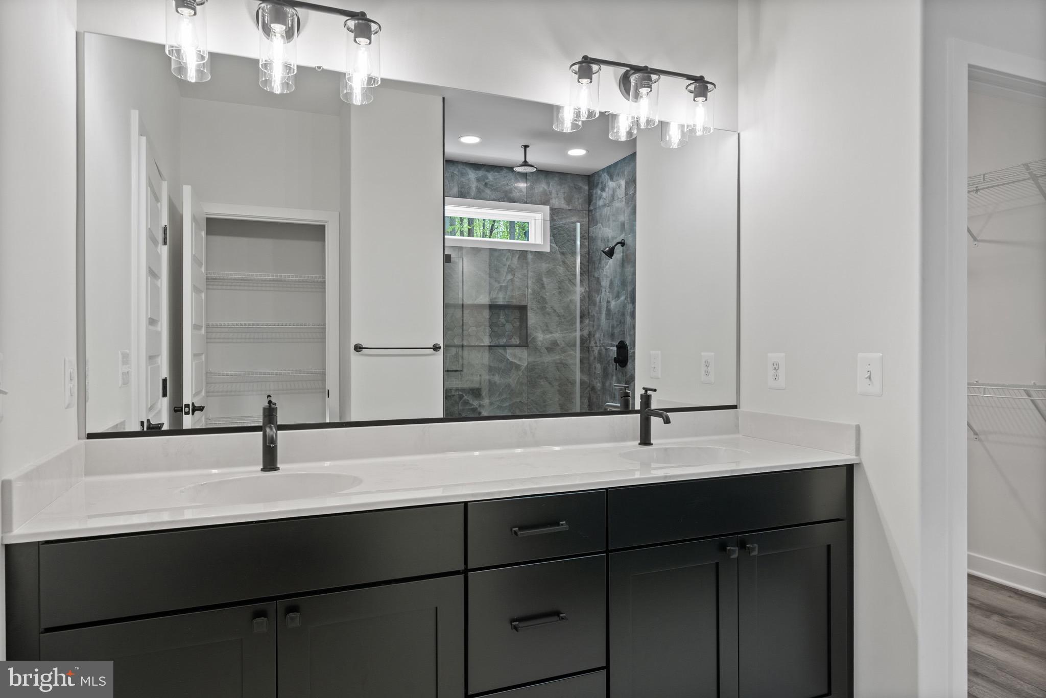 18688 Hebb Rd Valley Valley Lee, MD 20692 - Photo 28 of 57 Sleek modern bathroom with elegant finishes.
