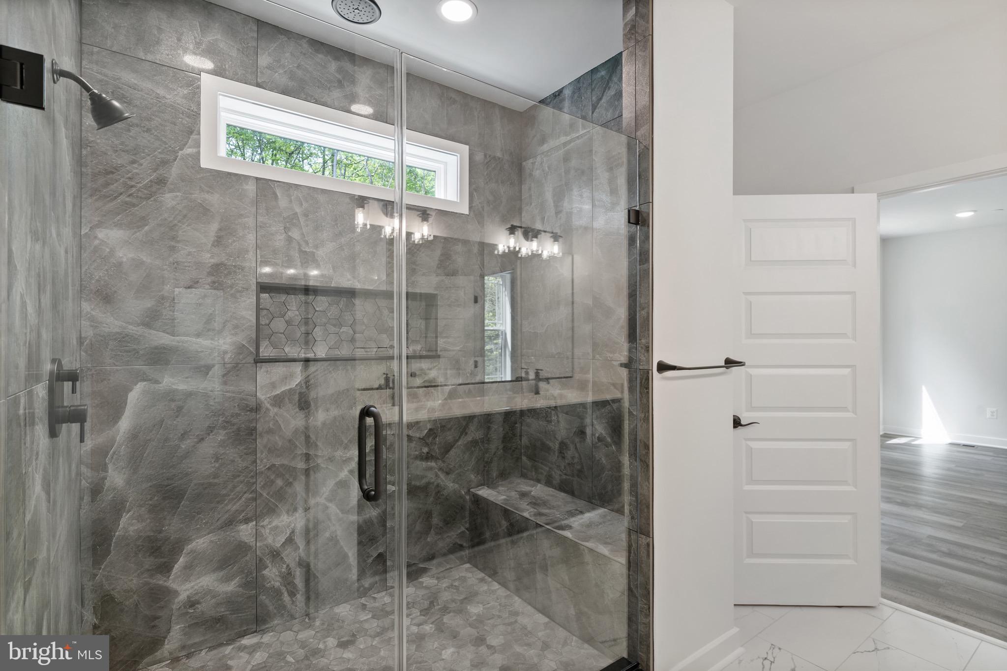 18688 Hebb Rd Valley Valley Lee, MD 20692 - Photo 29 of 57 Luxurious glass shower with elegant finishes.