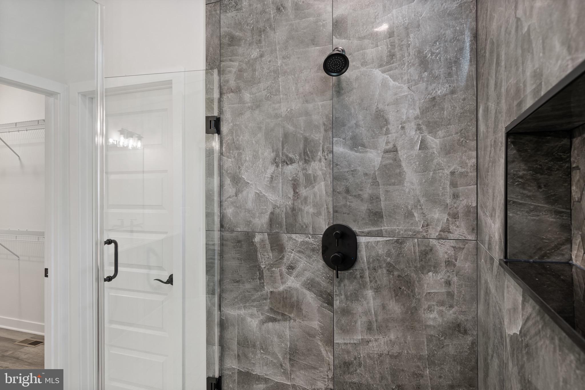 18688 Hebb Rd Valley Valley Lee, MD 20692 - Photo 30 of 57 Sleek modern shower with elegant tile design.