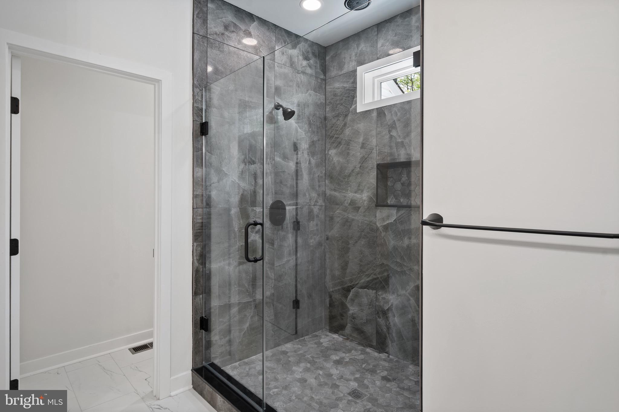 18688 Hebb Rd Valley Valley Lee, MD 20692 - Photo 31 of 57 Sleek modern shower with elegant stone design.