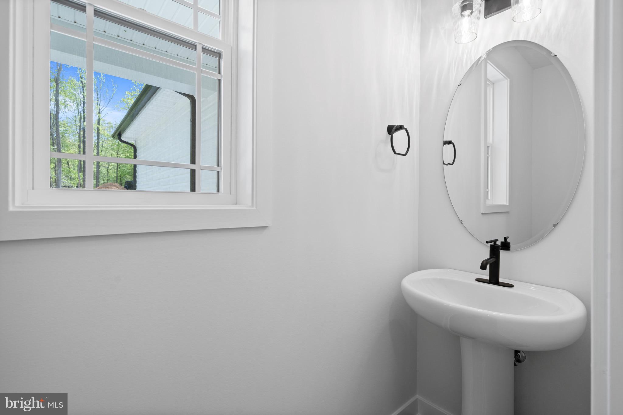 18688 Hebb Rd Valley Valley Lee, MD 20692 - Photo 33 of 57 Bright and airy half-bath with modern touches.