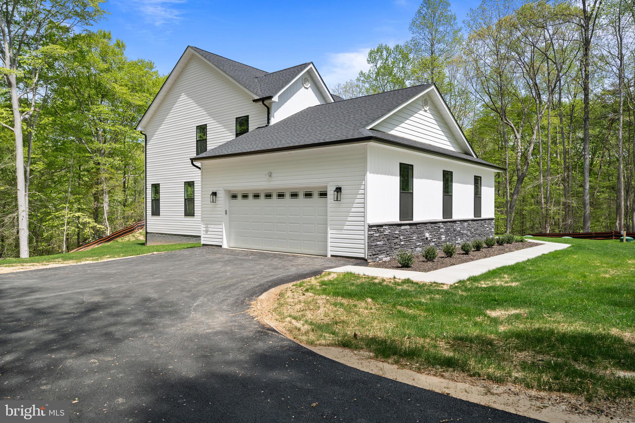18688 Hebb Rd Valley Valley Lee, MD 20692 - Photo 8 of 57 Modern home nestled in serene greenery.