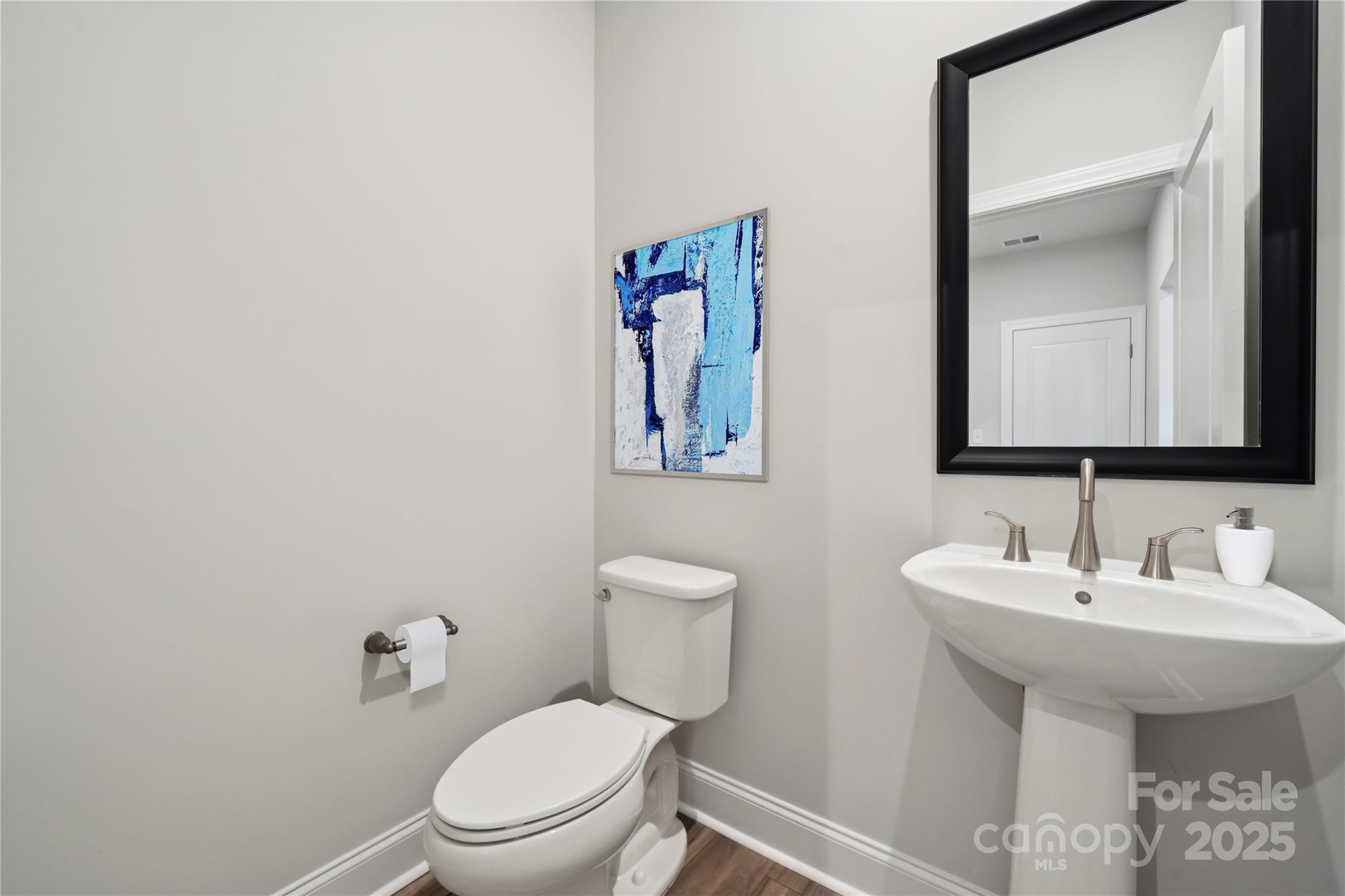 1233 Margo Mannor None Fort Mill Fort Mill, SC 29708 - Photo 21 of 34 a bathroom with a toilet a sink and mirror