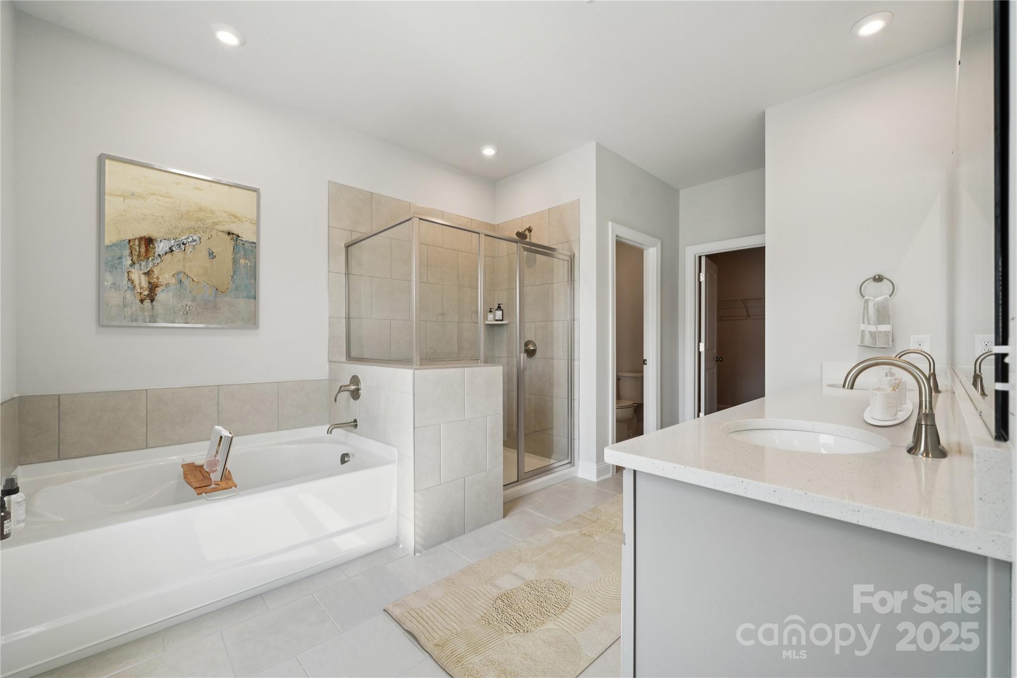 1233 Margo Mannor None Fort Mill Fort Mill, SC 29708 - Photo 8 of 34 a bathroom with a tub sink and mirror