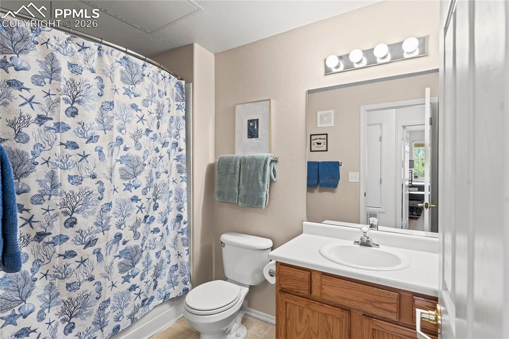 3976 Riviera Grove, Unit 203 Colorado Springs, CO 80922 - Photo 26 of 45 a bathroom with a sink toilet and shower