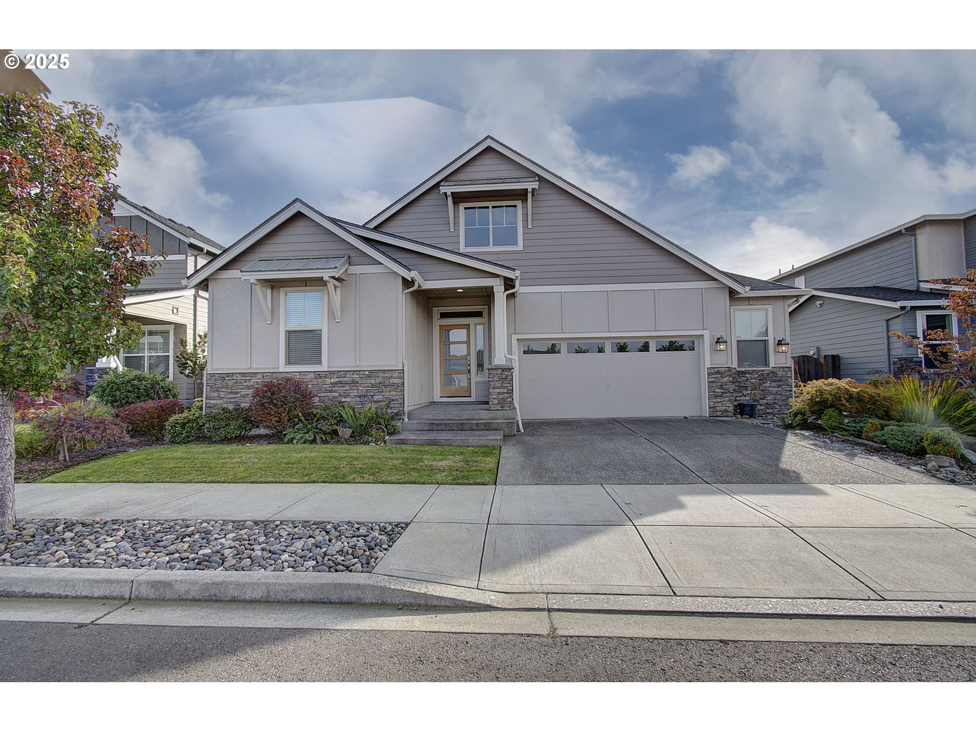 5305 Northeast 134th Street Vancouver, WA 98686 - Photo 1 of 36 a front view of a house with a yard