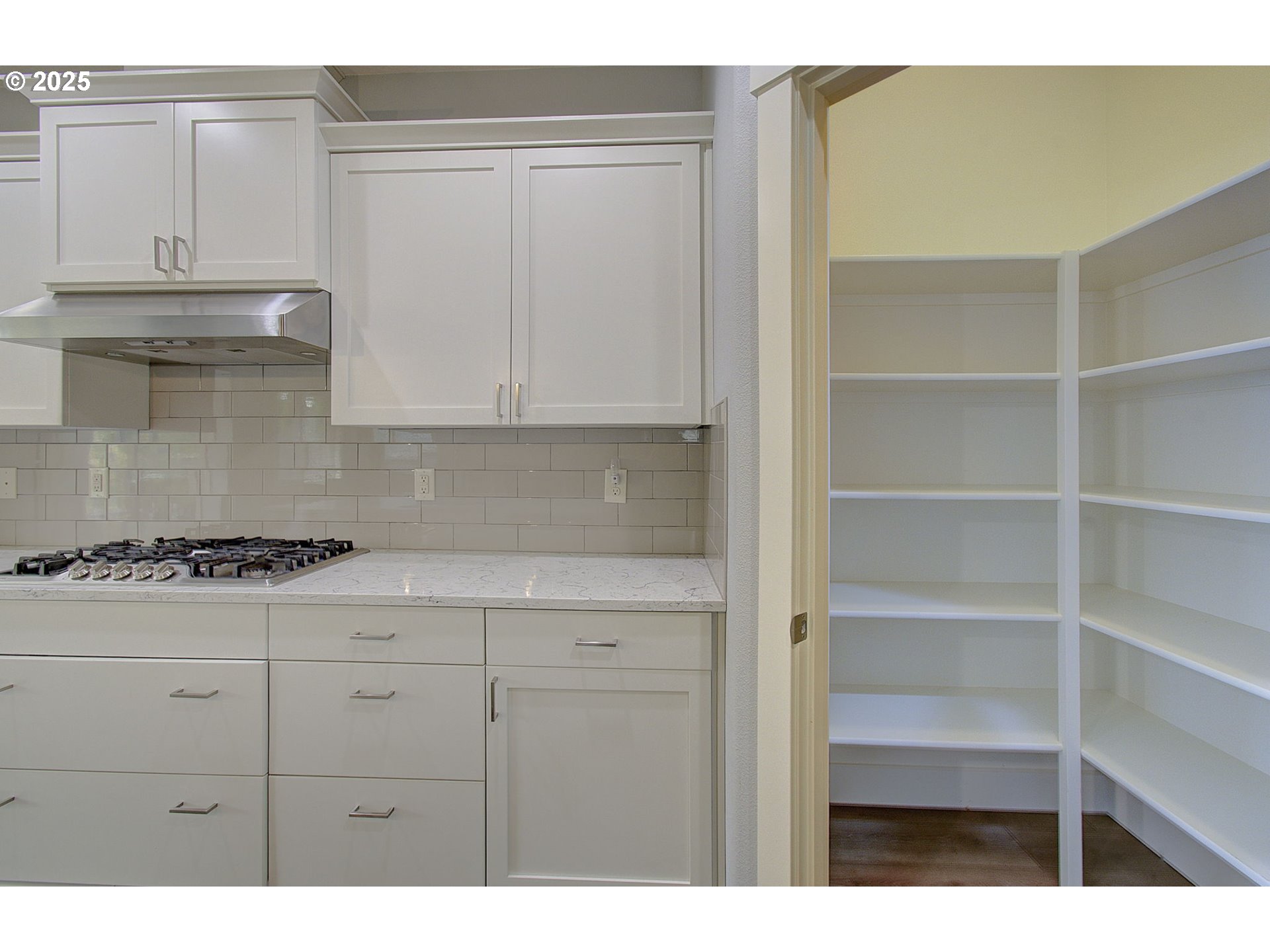 5305 Northeast 134th Street Vancouver, WA 98686 - Photo 11 of 36 a kitchen with white cabinets and appliances