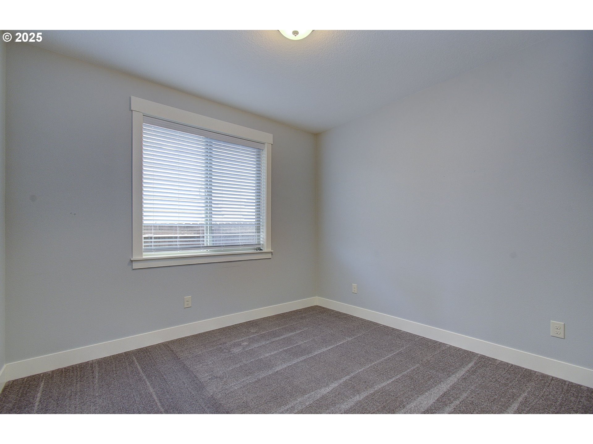 5305 Northeast 134th Street Vancouver, WA 98686 - Photo 18 of 36 a view of an empty room with wooden floor and a window