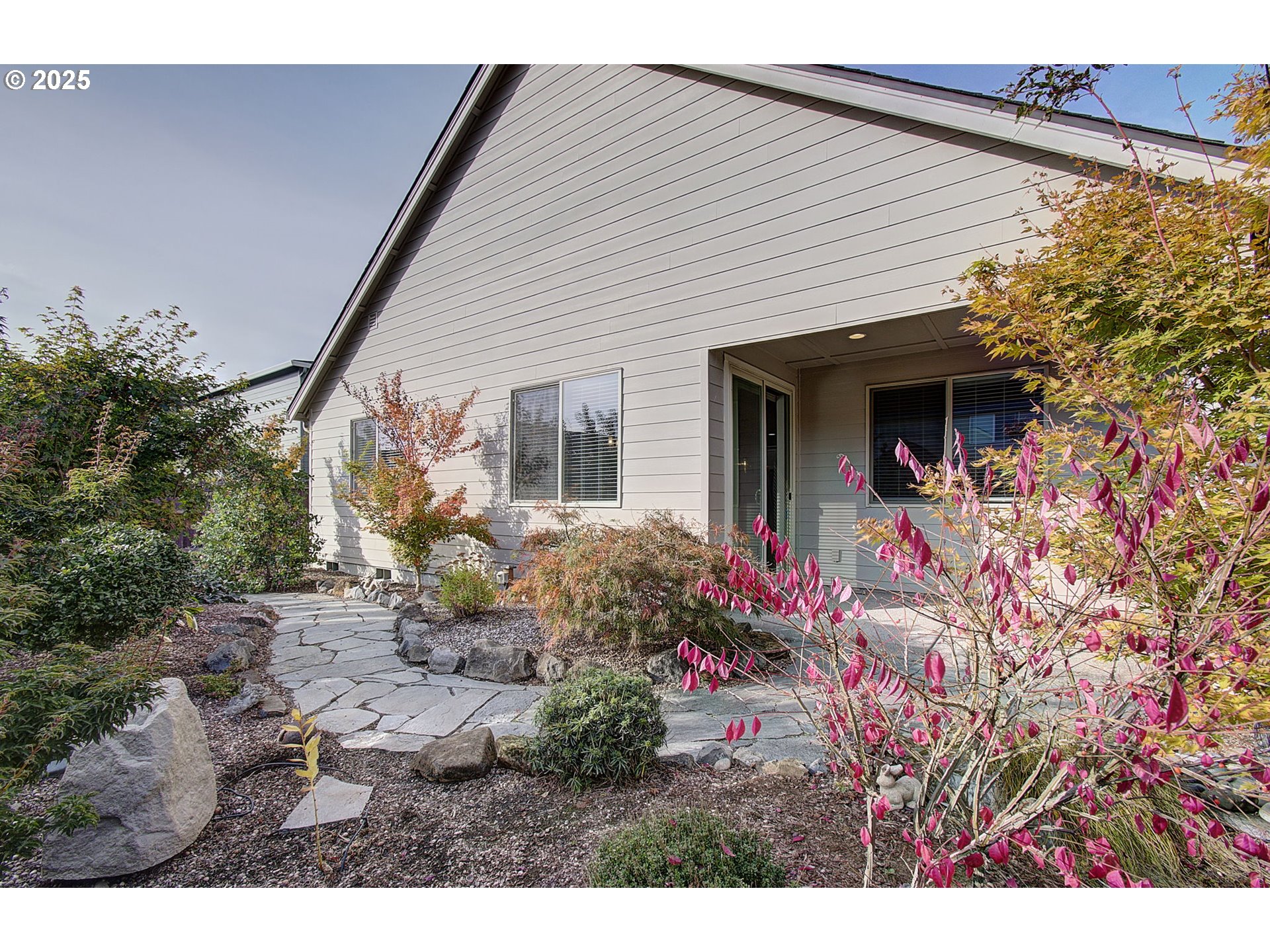 5305 Northeast 134th Street Vancouver, WA 98686 - Photo 32 of 36 a backyard of a house with table and chairs and potted plants