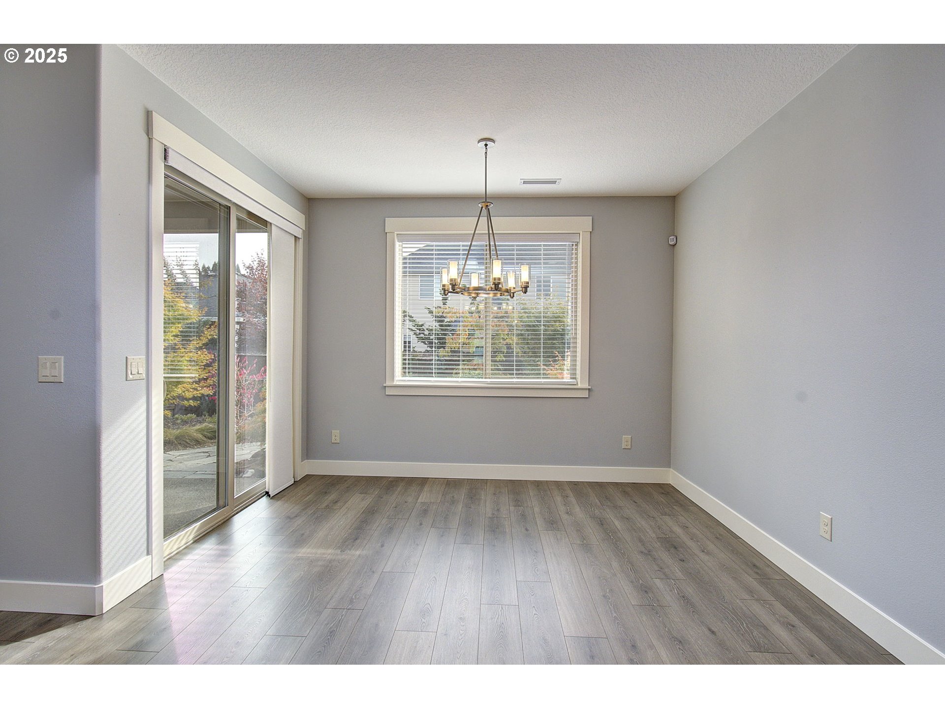 5305 Northeast 134th Street Vancouver, WA 98686 - Photo 4 of 36 a view of an empty room with wooden floor and a window
