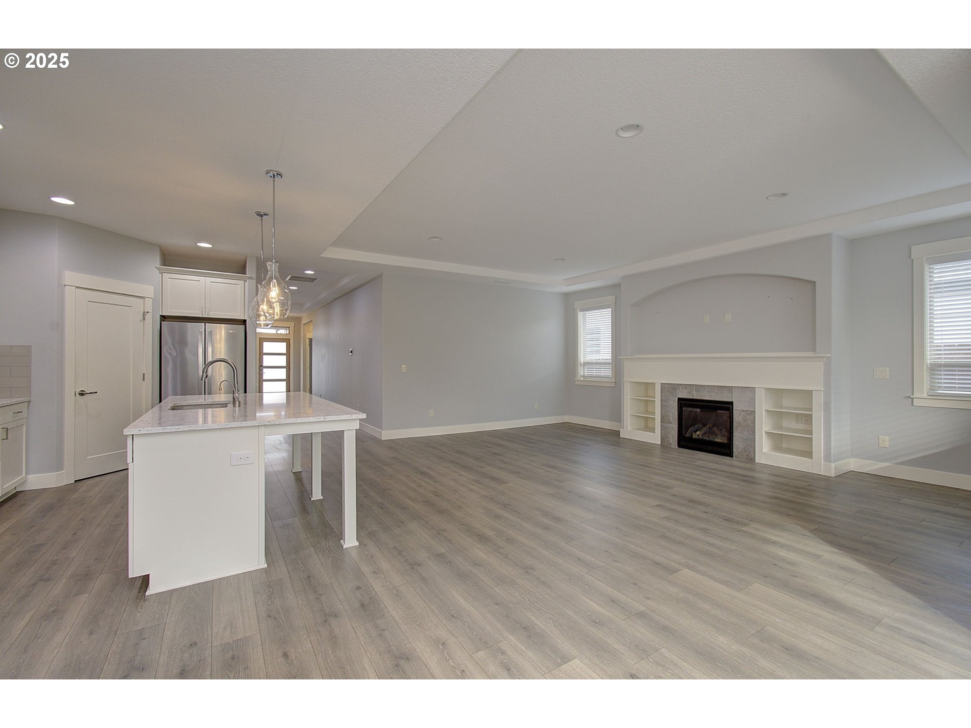 5305 Northeast 134th Street Vancouver, WA 98686 - Photo 6 of 36 a view of a livingroom with furniture wooden floor and a fireplace