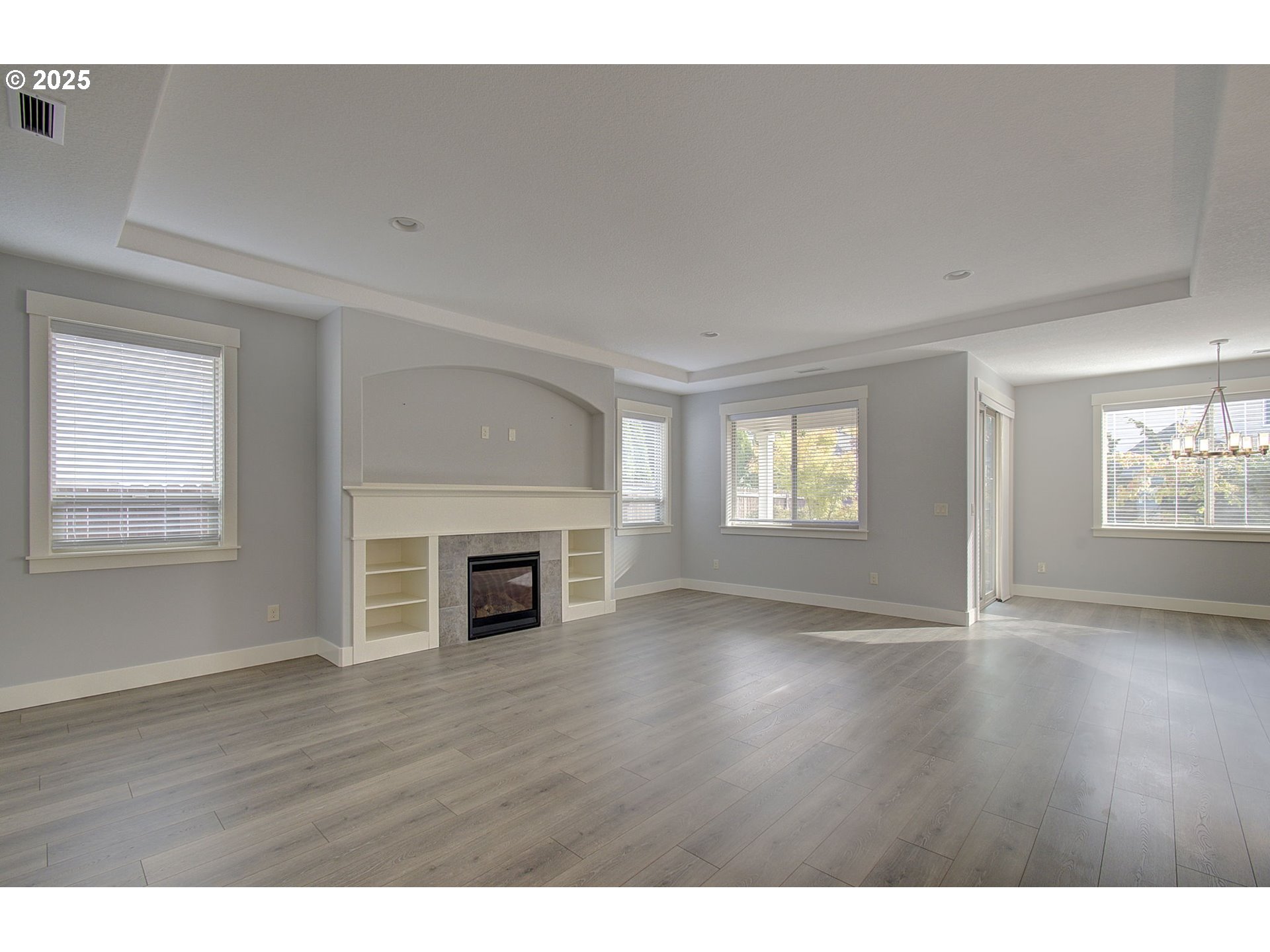 5305 Northeast 134th Street Vancouver, WA 98686 - Photo 9 of 36 a view of an empty room with wooden floor and a window