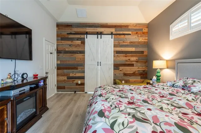 a bedroom with a bed and a dresser