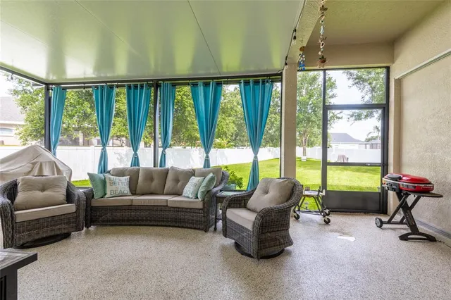 a living room with furniture and a window