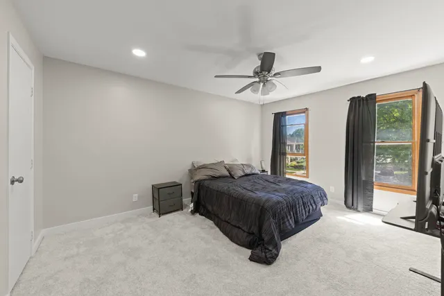 a room with a bed and a chandelier