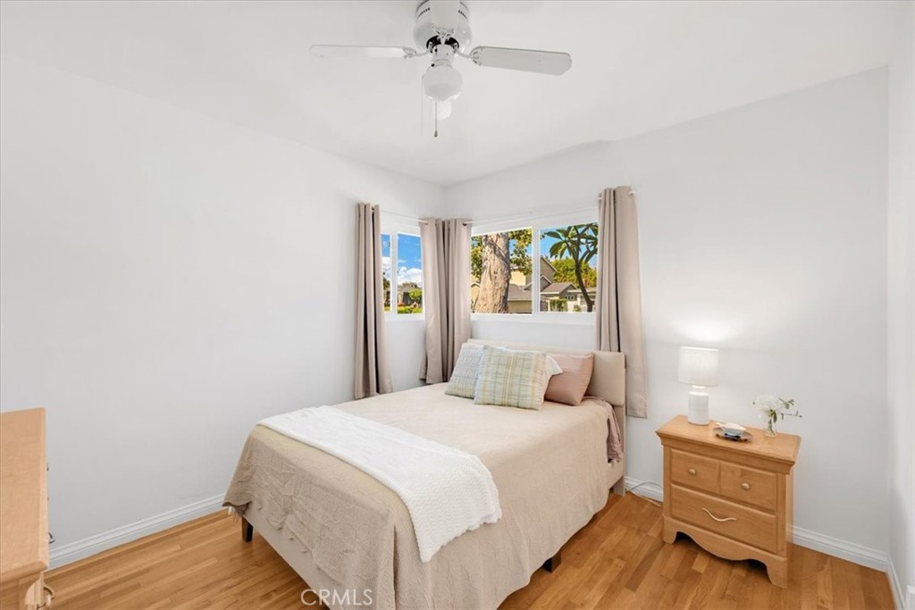 2956 Monogram Avenue Long Beach, CA 90815 - Photo 15 of 29 a bedroom with a bed and a chandelier