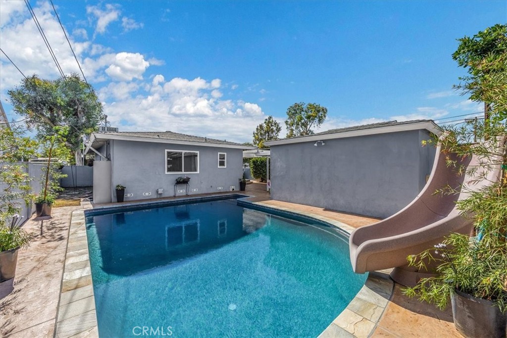 2956 Monogram Avenue Long Beach, CA 90815 - Photo 23 of 29 a view of a backyard with a tub and fire pit