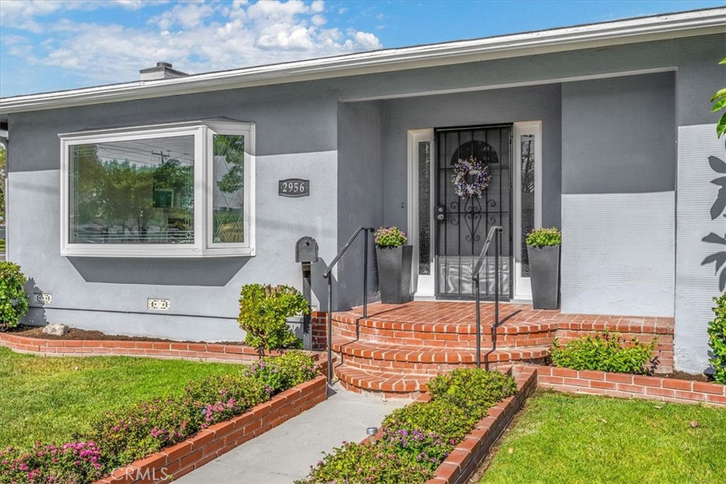 2956 Monogram Avenue Long Beach, CA 90815 - Photo 4 of 29 a front view of a house with garden