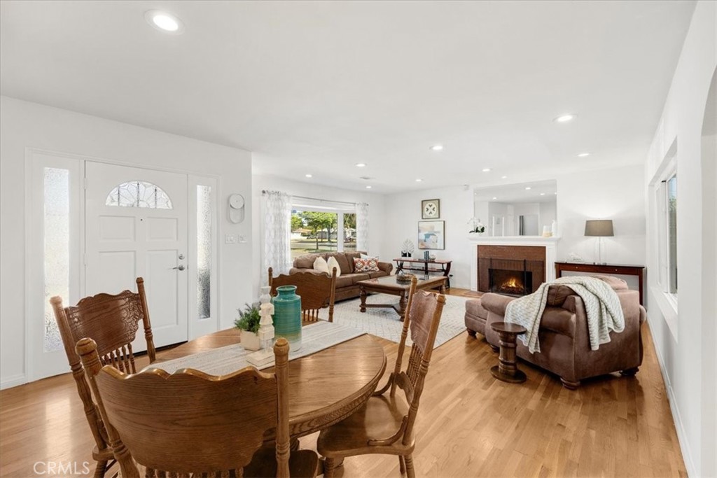 2956 Monogram Avenue Long Beach, CA 90815 - Photo 7 of 29 a living room with furniture a fireplace and a table