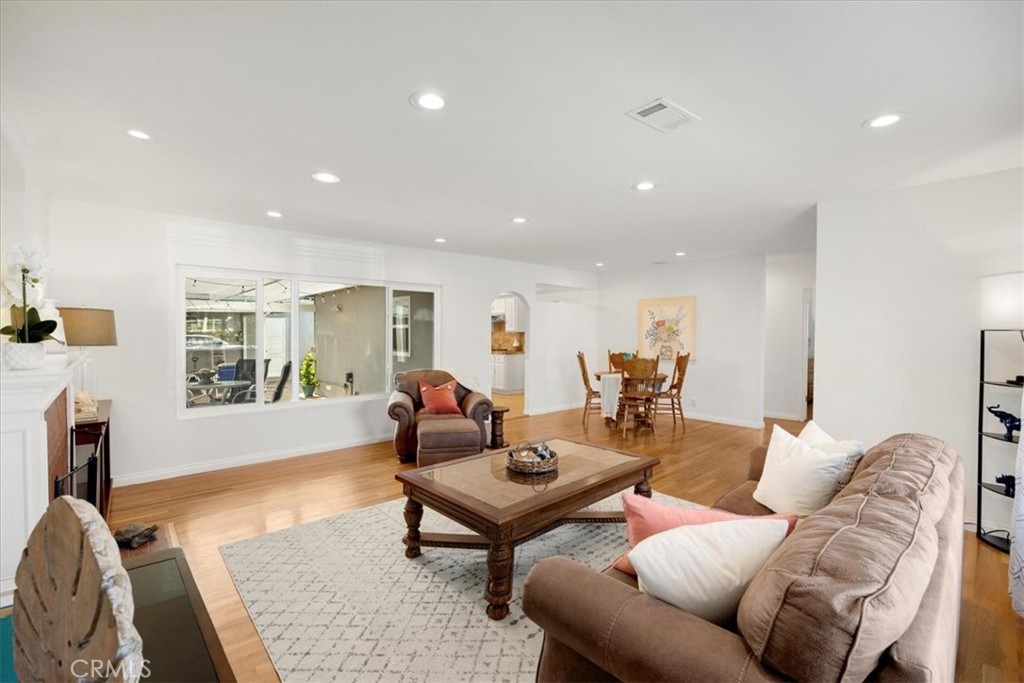 2956 Monogram Avenue Long Beach, CA 90815 - Photo 8 of 29 a living room with furniture or couch and a wooden floor