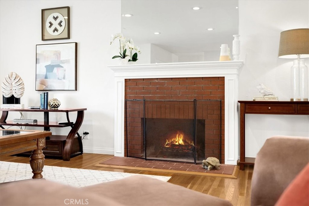 2956 Monogram Avenue Long Beach, CA 90815 - Photo 9 of 29 a living room with furniture and a fireplace