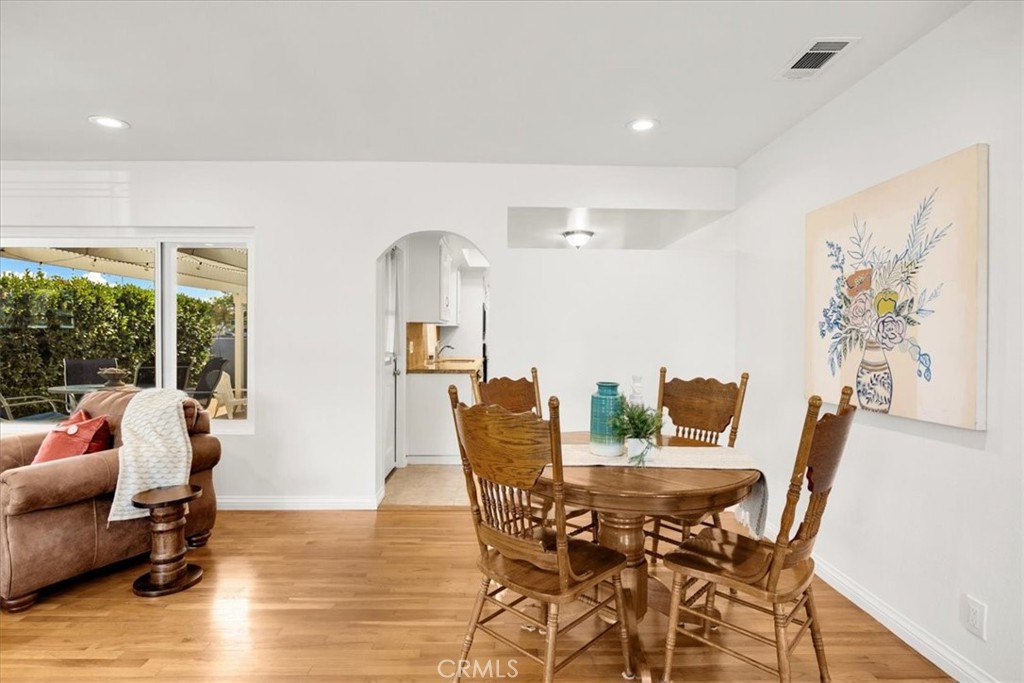 2956 Monogram Avenue Long Beach, CA 90815 - Photo 10 of 29 a view of a dining room with furniture window and wooden floor