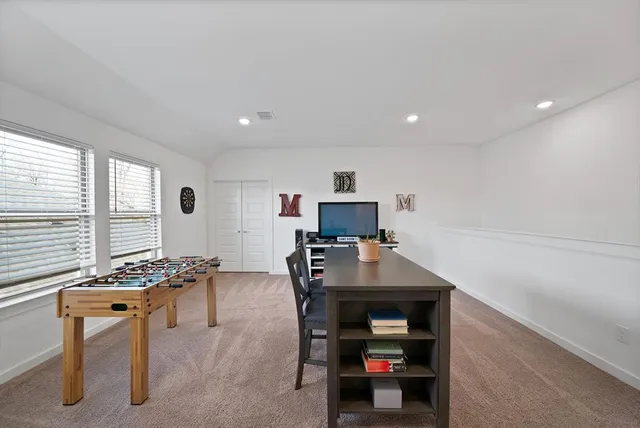 a room with furniture and a window