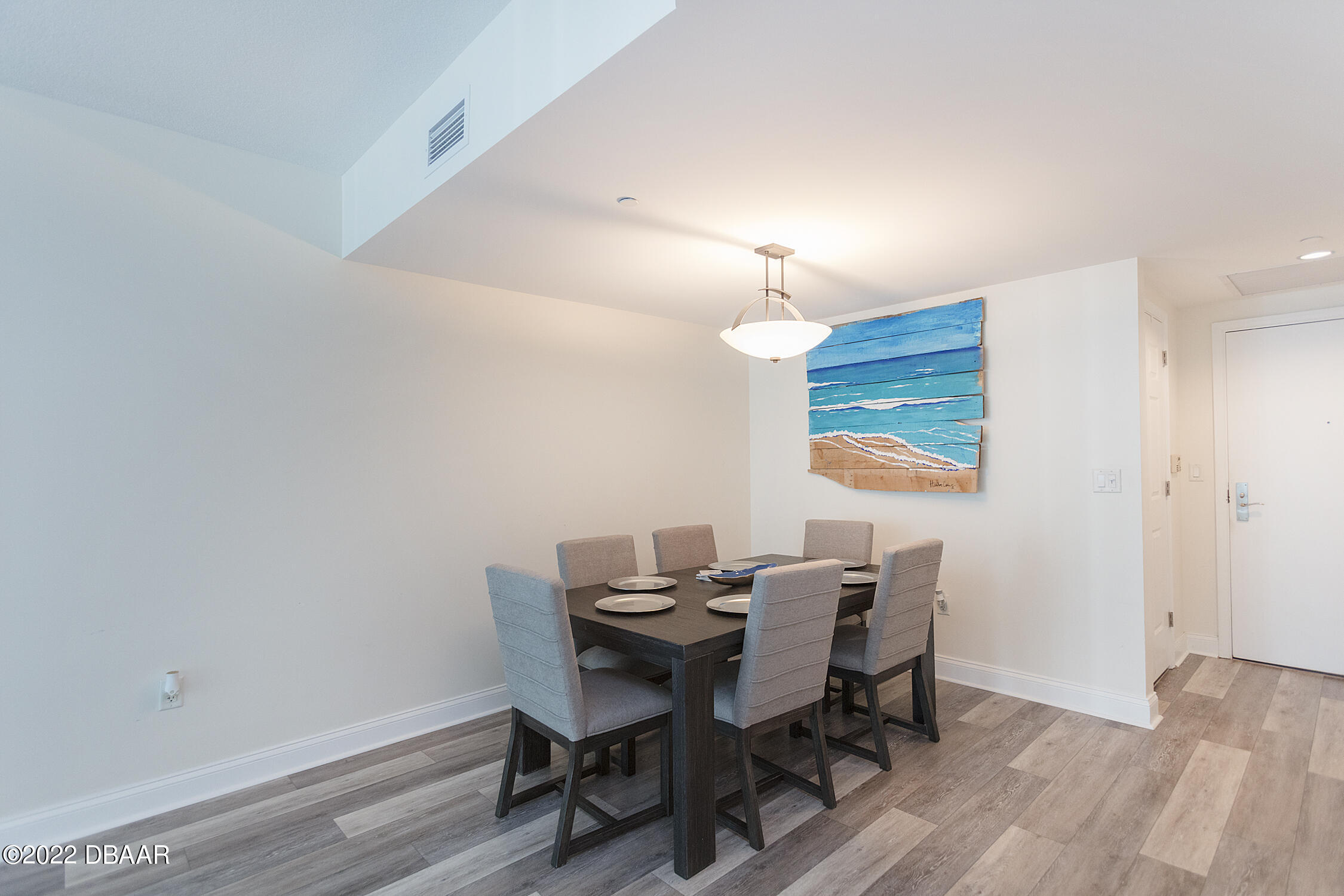 231 Riverside Drive, Unit 11061 Holly Hill, FL 32117 - Photo 12 of 64 a view of a dining room with furniture and wooden floor